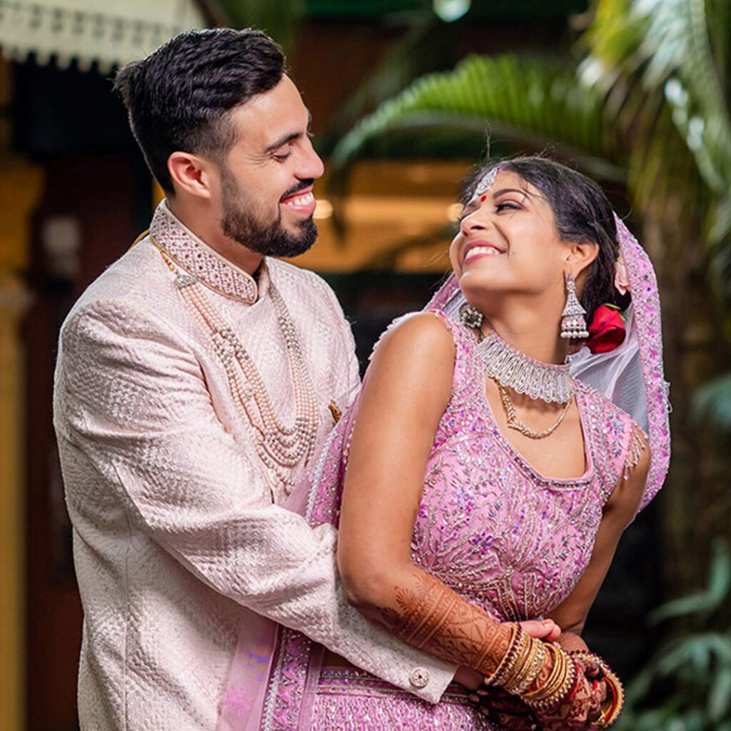 Traditional wedding photography of bride and groom in elegant bridal attire.