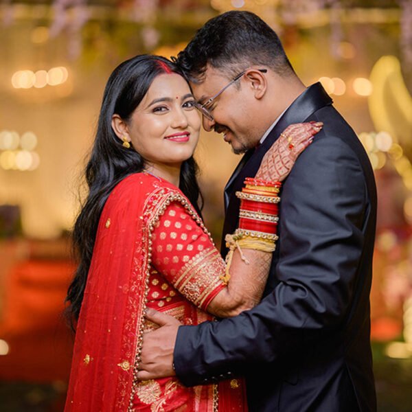 Traditional wedding couple portrait with bride and groom embracing during the ceremony.
