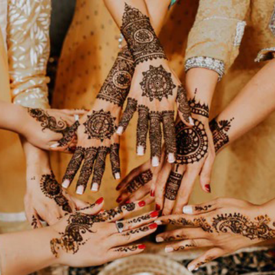 Bridal mehndi designs on hands with intricate traditional henna patterns.
